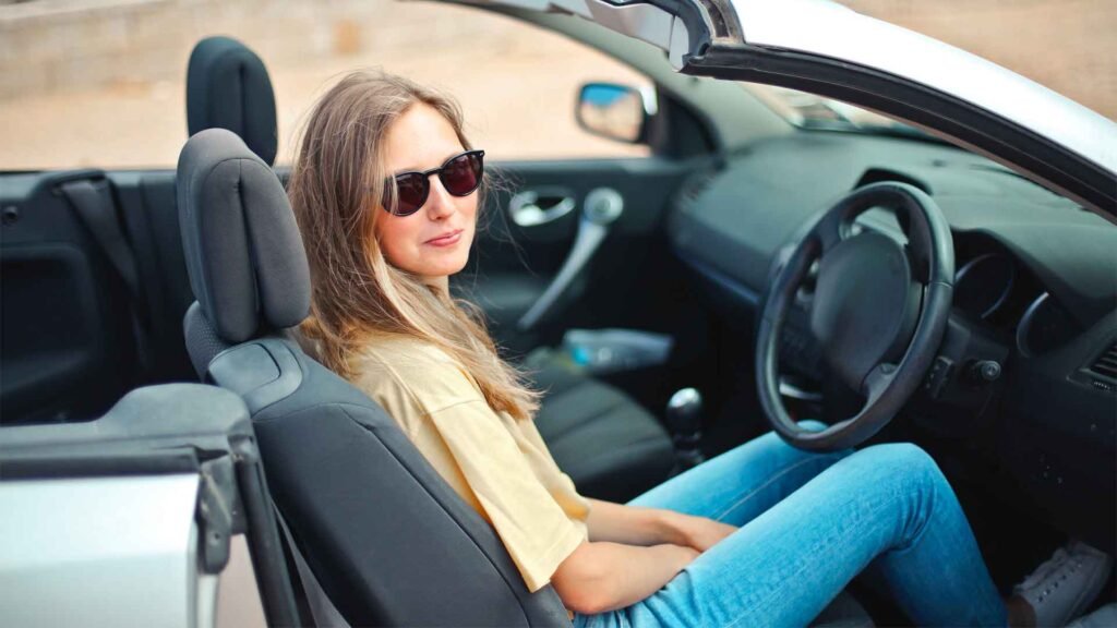 Learner driver sitting in the driver's seat of a car
